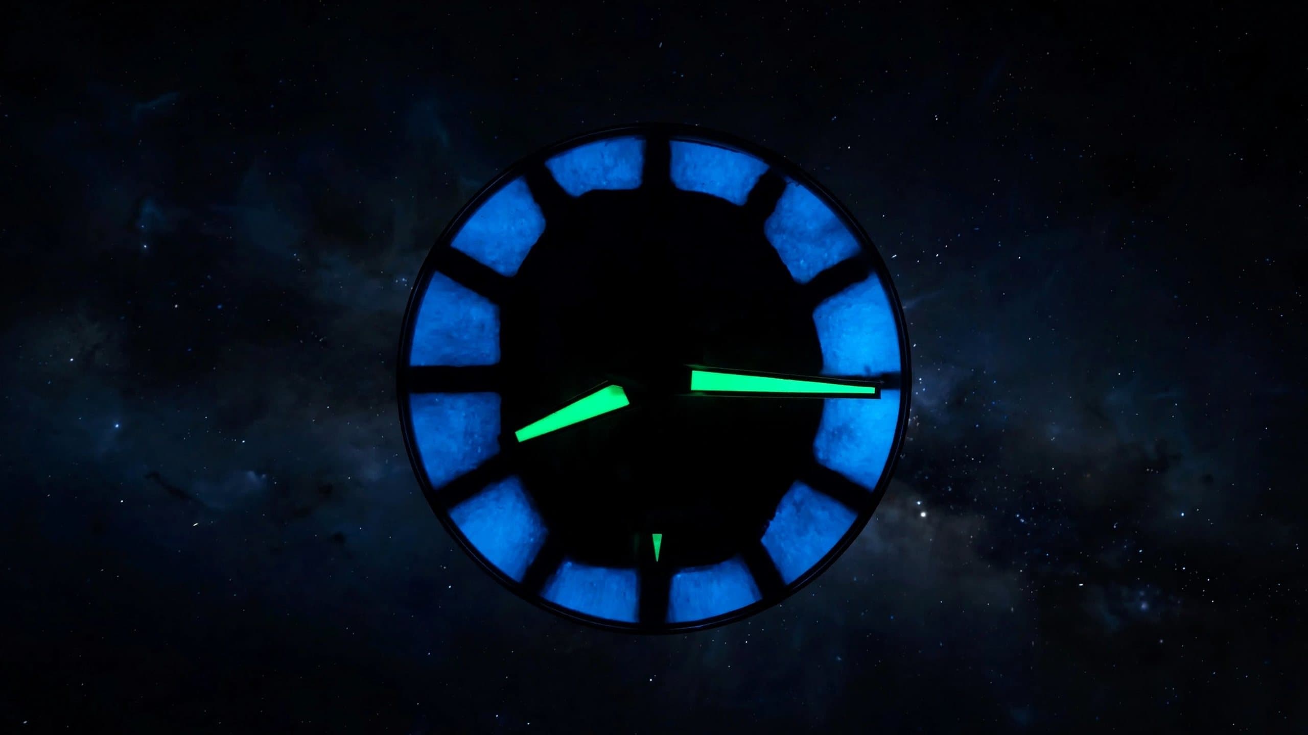 The luminous dial of Edition 01 glowing against a night sky