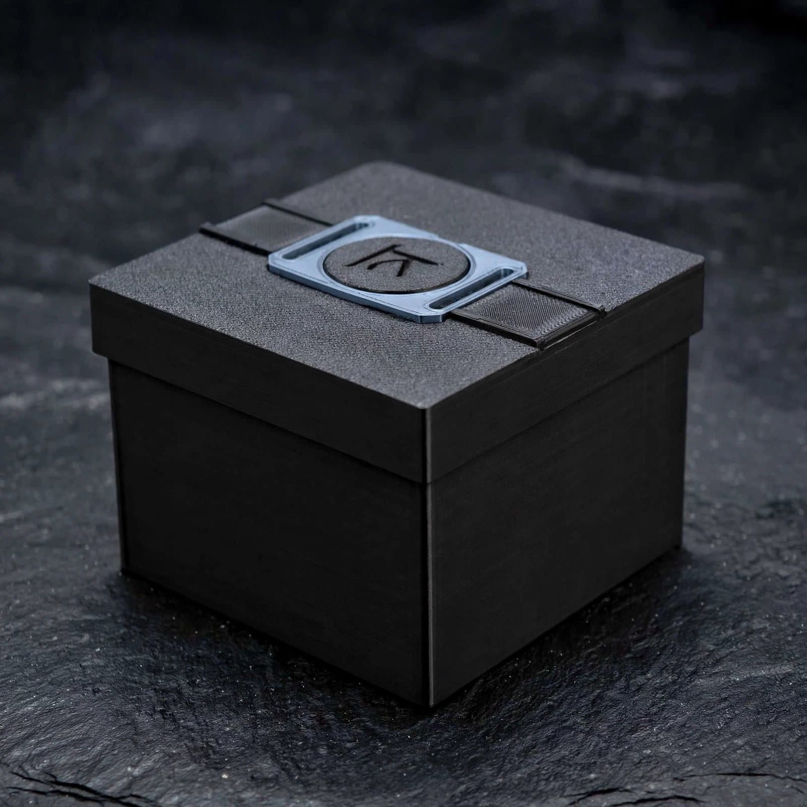 The black presentation box with the Yantra monogram on its band