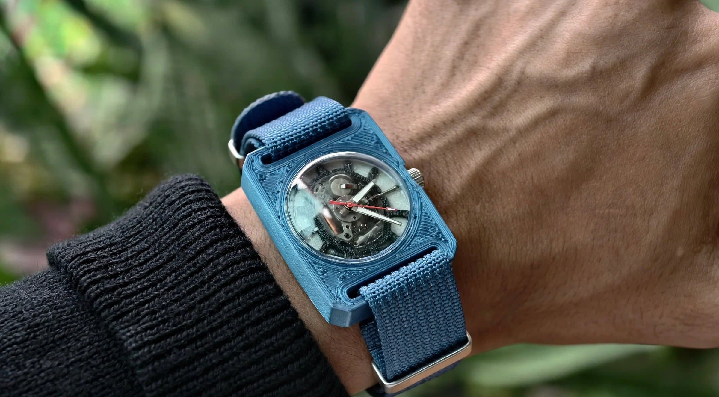 Edition 01 worn on the wrist with its blue woven strap